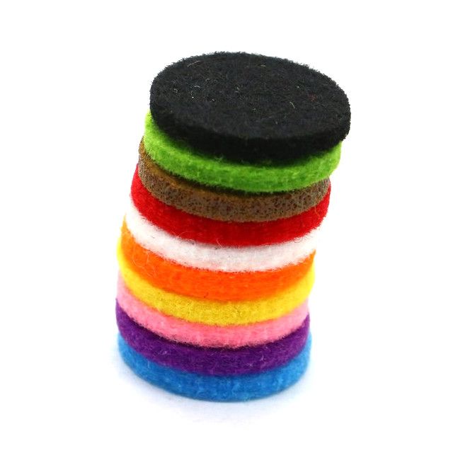 Stack of colorful round felt pads on a white background