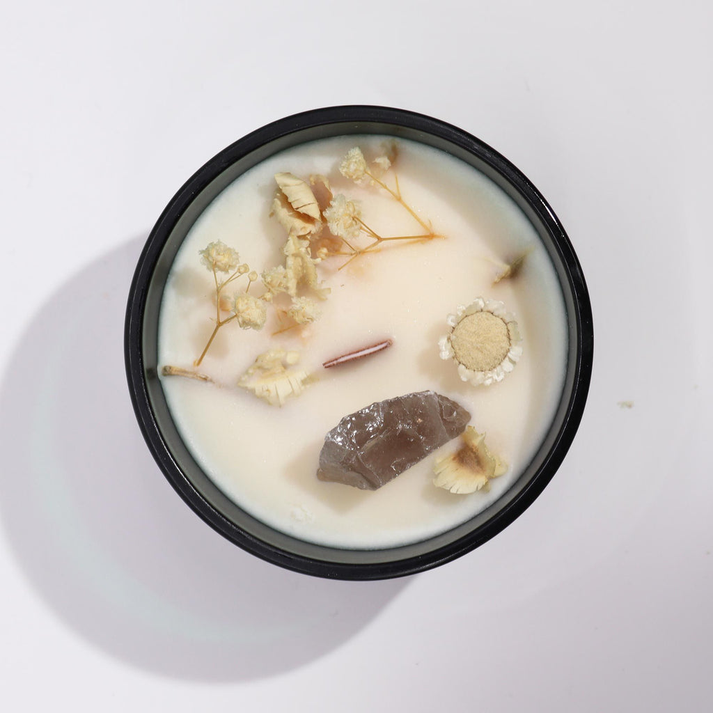 The Lion tarot candle with natural botanicals and rock quartz crystal