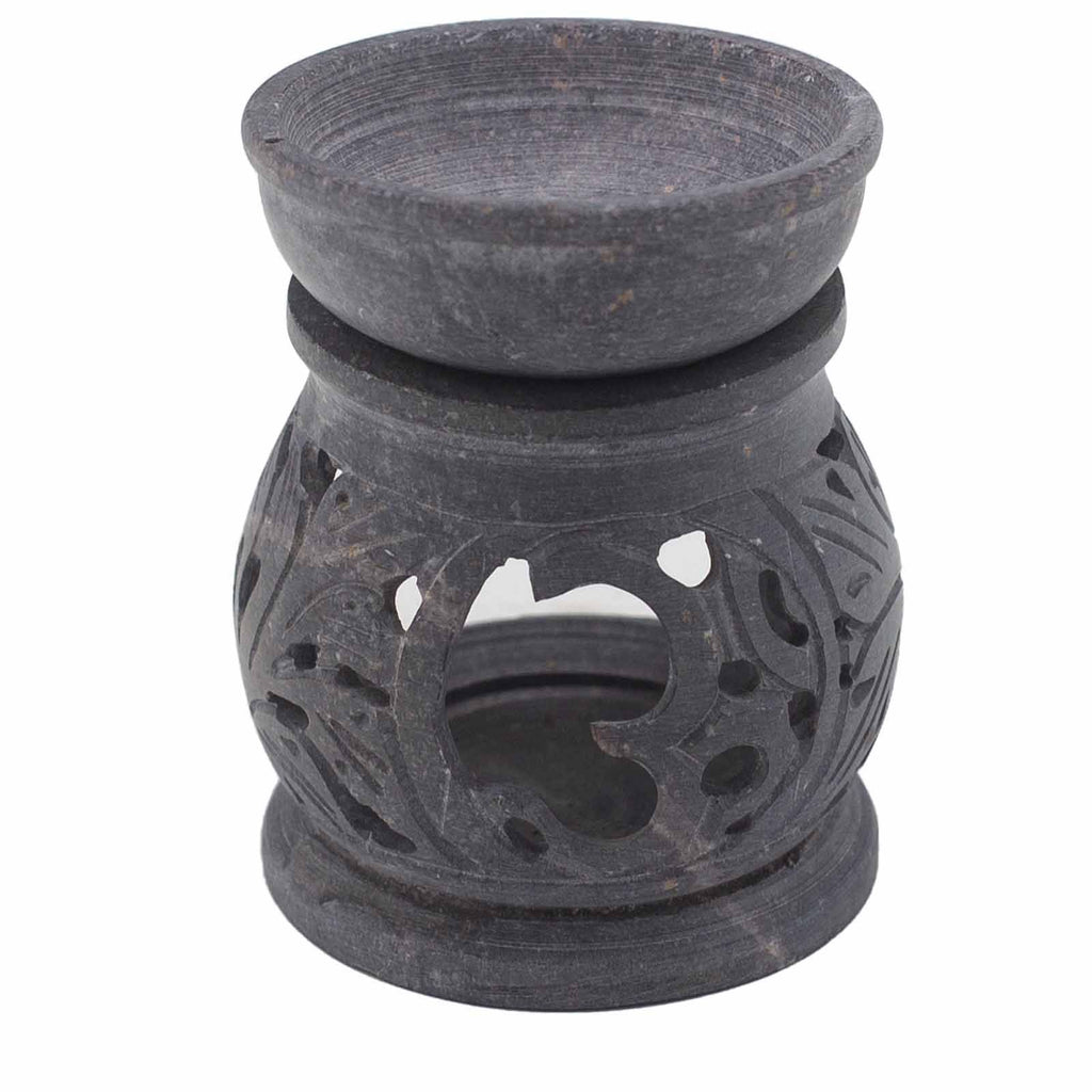 Black ceramic oil burner with decorative design on a white background
