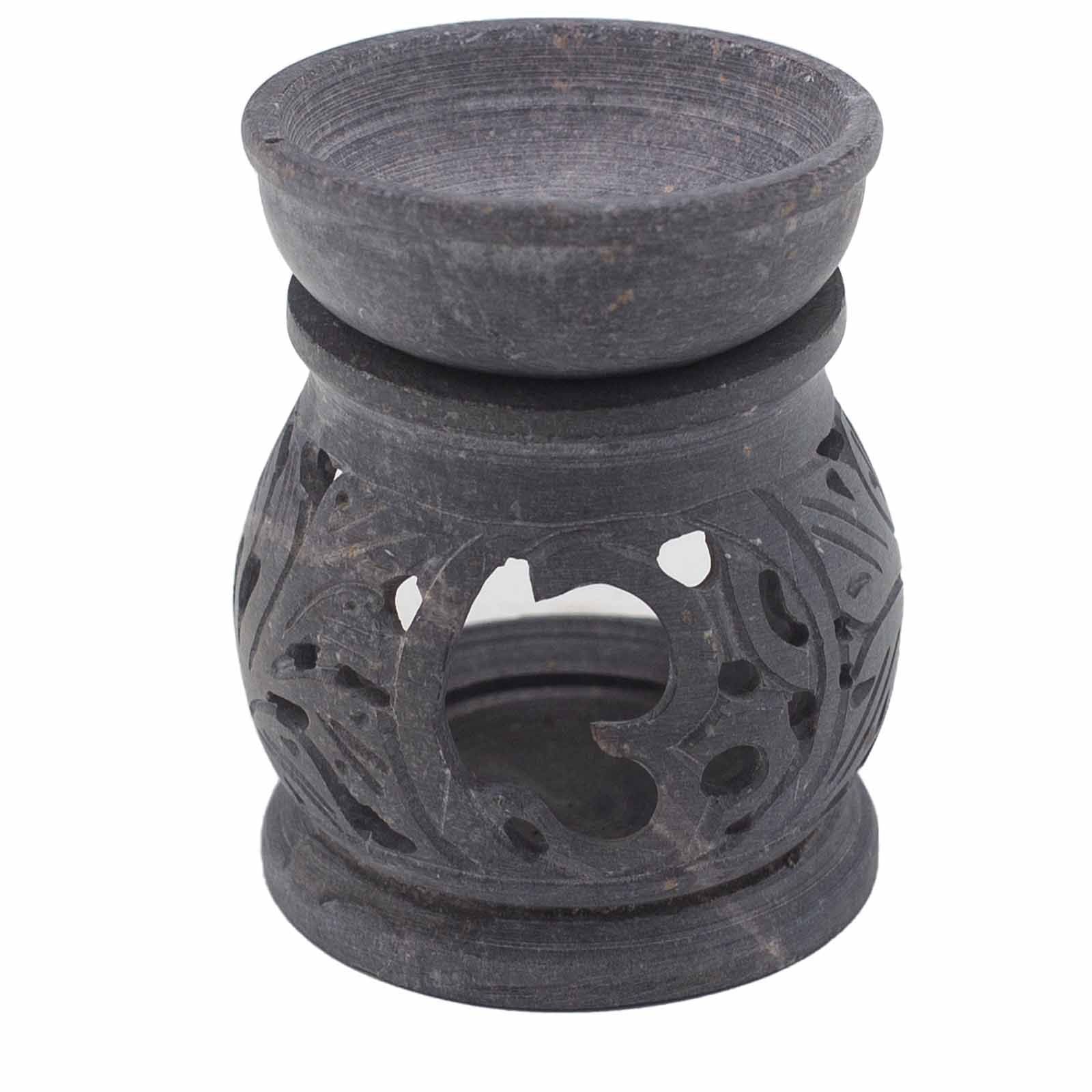 Black ceramic oil burner with decorative design on a white background