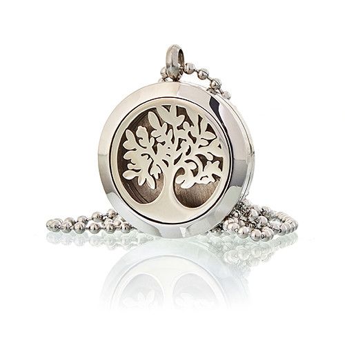 Silver locket with tree design on a white background