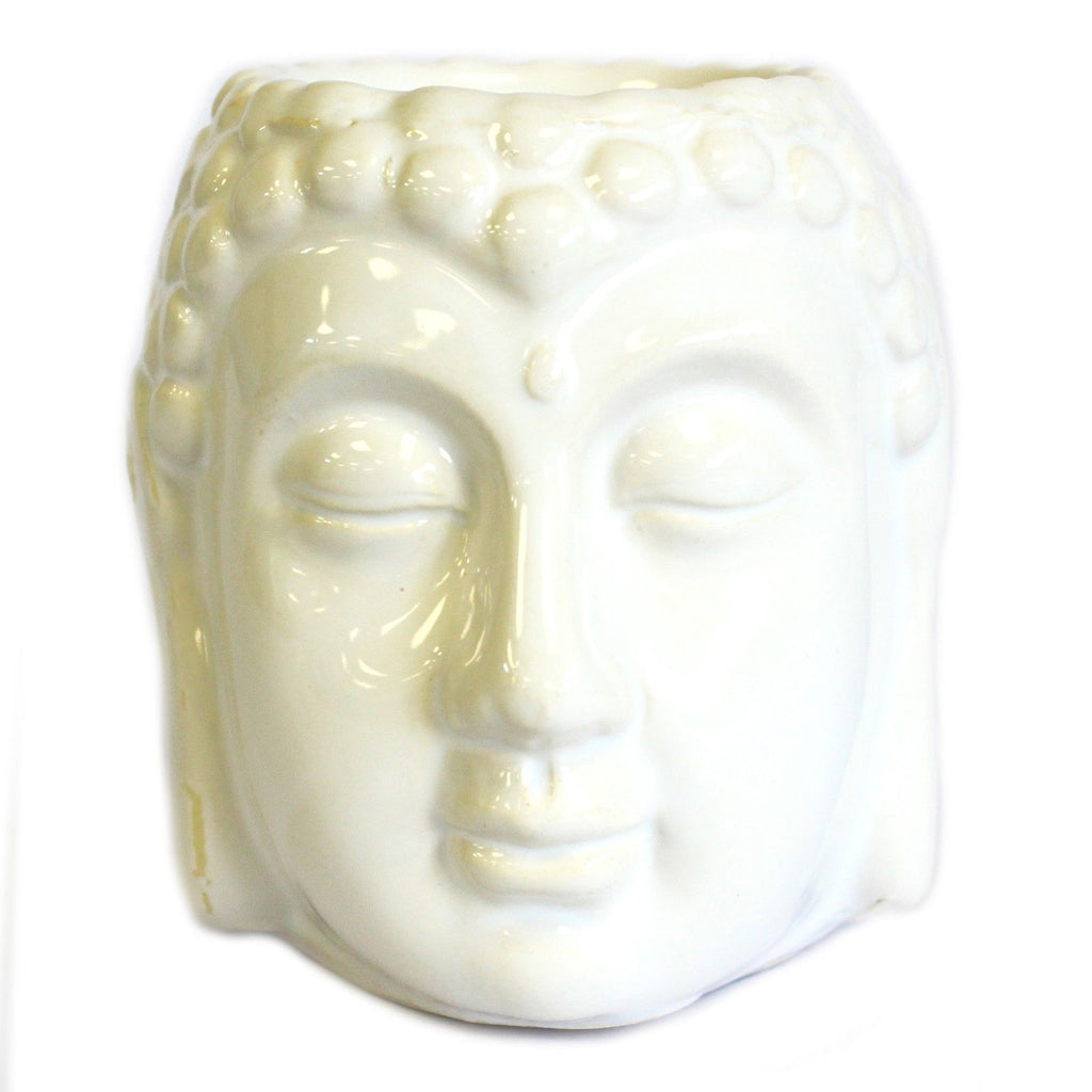 White ceramic Buddha head on a white background