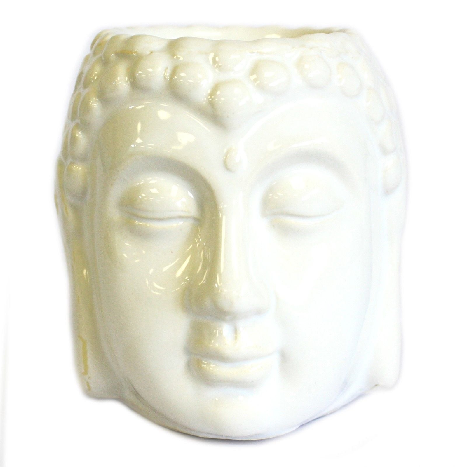 White ceramic Buddha head on a white background