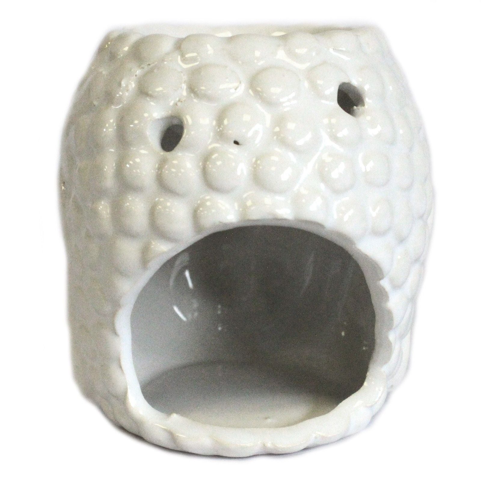 White textured ceramic oil warmer on a white background