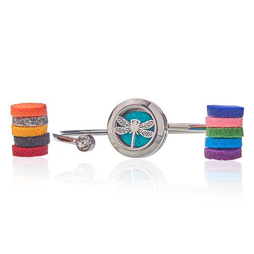 Bangle with dragonfly design and colorful felt refill pads on a white background