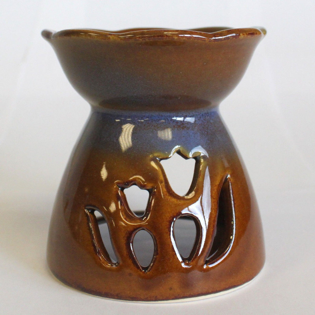 Brown ceramic oil burner with tulip cut-out design on a white background