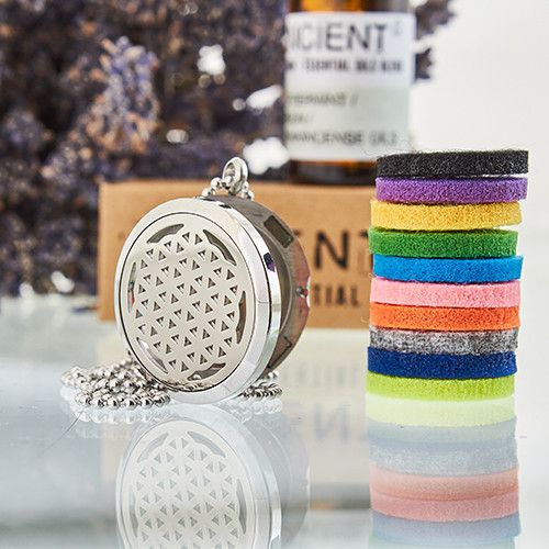 Sacred geometry locket necklace with Flower of Life design and 10 coloured refill pads