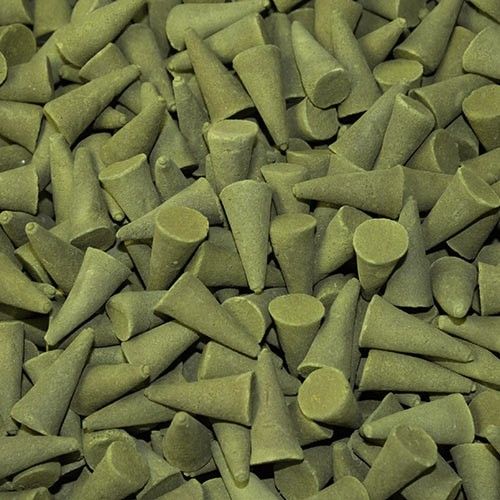 Close-up of a pile of green incense cones.