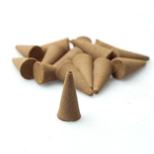 Brown incense cones on a white background