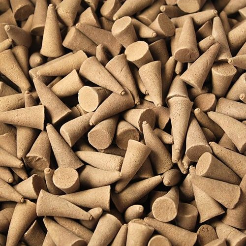 Close-up of a pile of brown incense cones