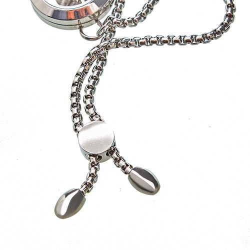 Close up of the chain of a pendant on a white background