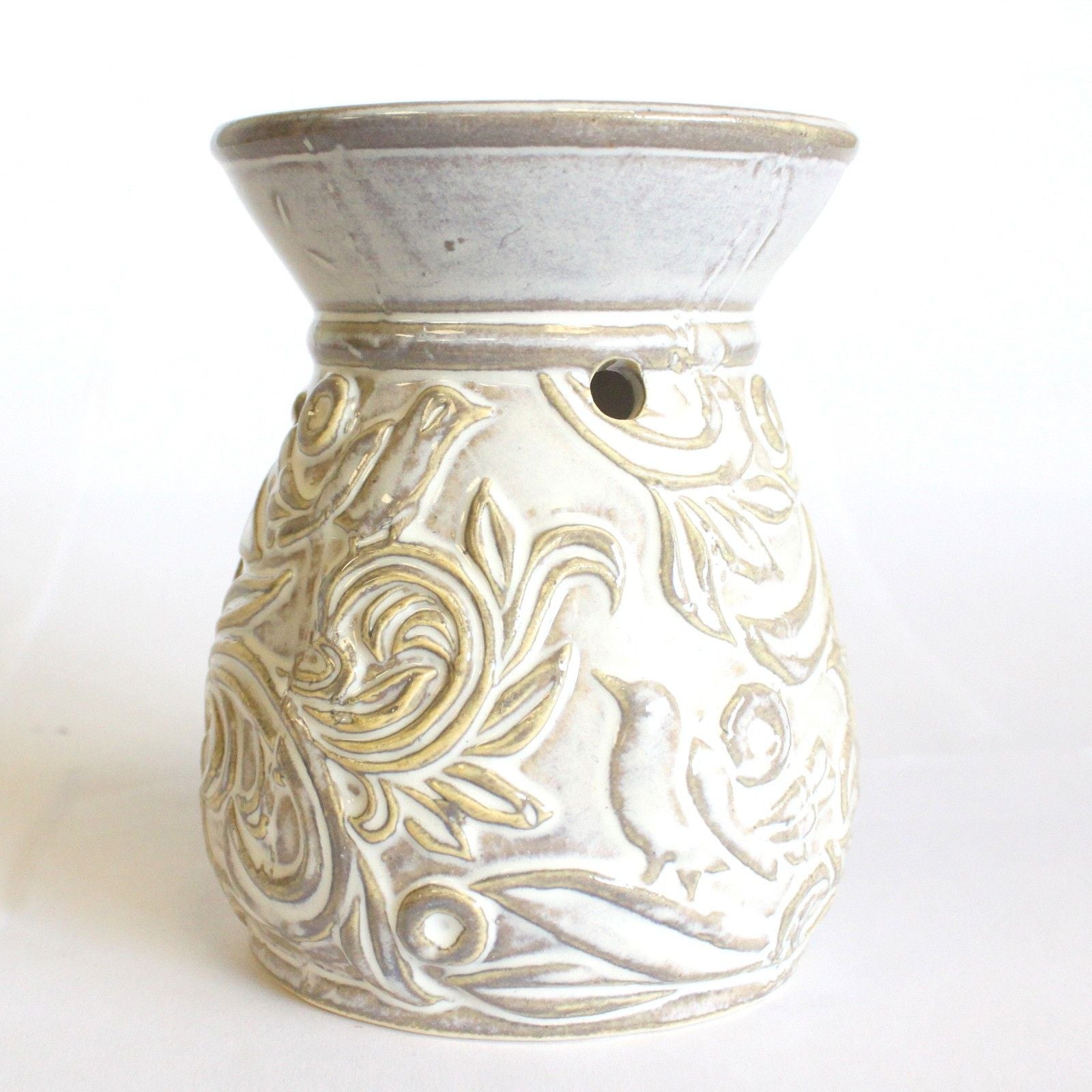 Decorative ceramic oil burner with floral patterns on a white background