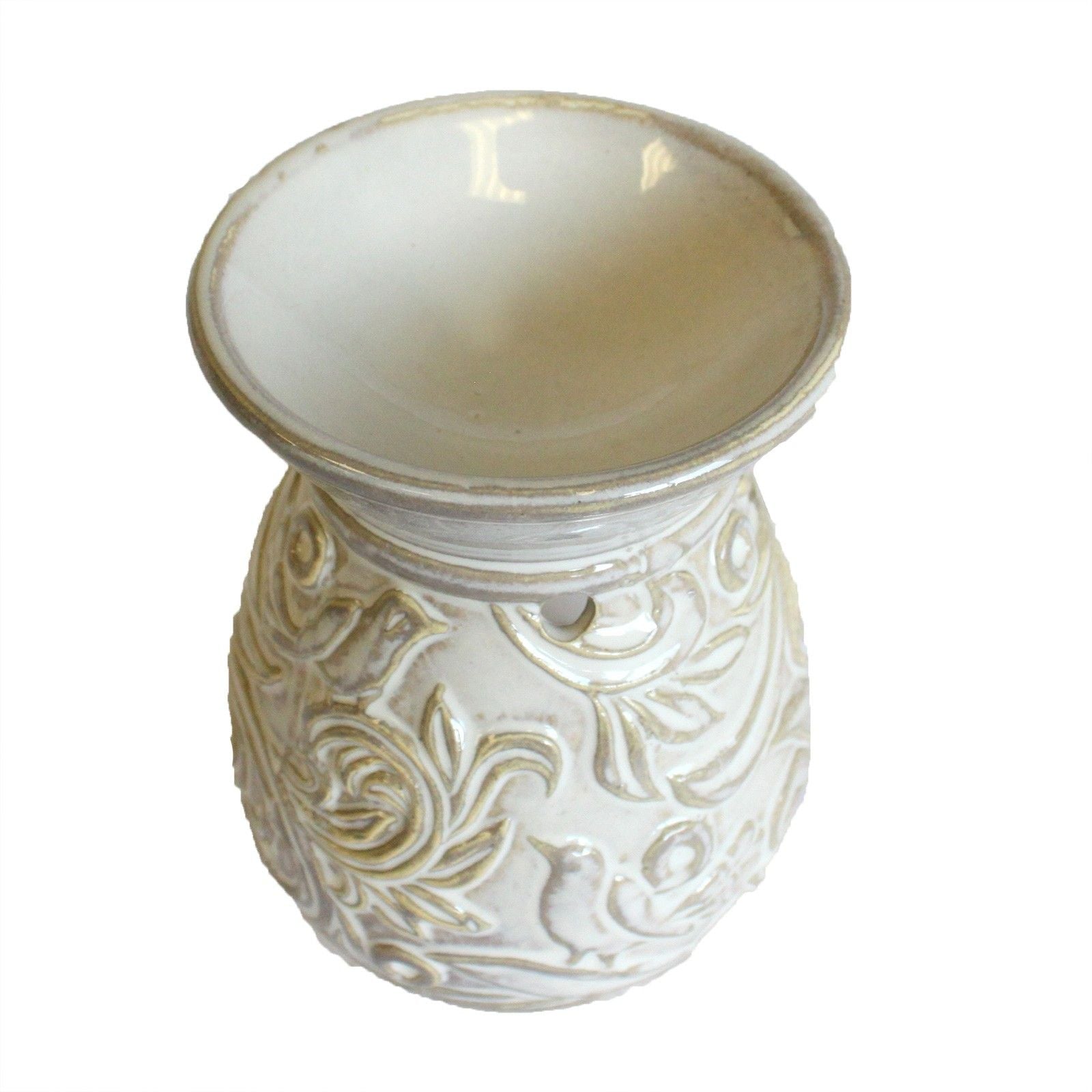 Decorative ceramic oil burner with embossed design on a white background