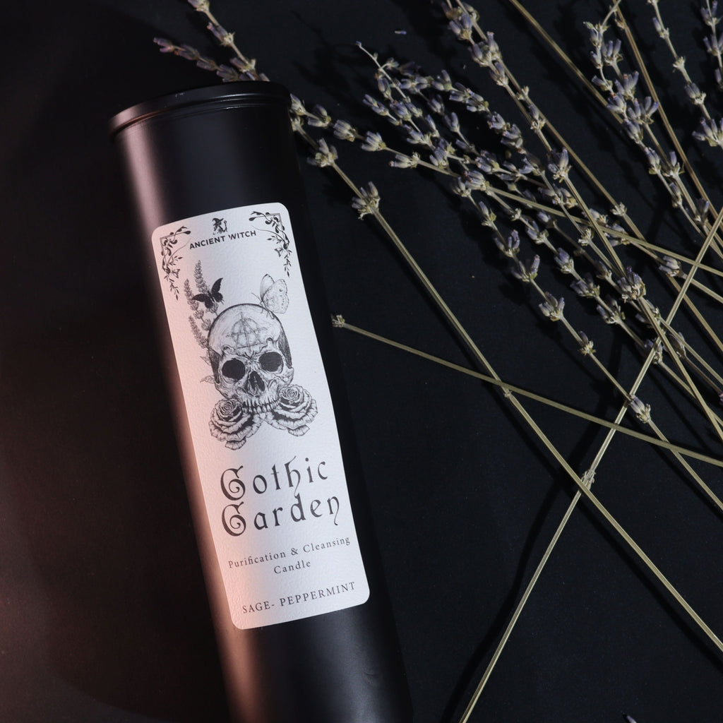 Candle with 'Gothic Garden' label on a black background with lavender.