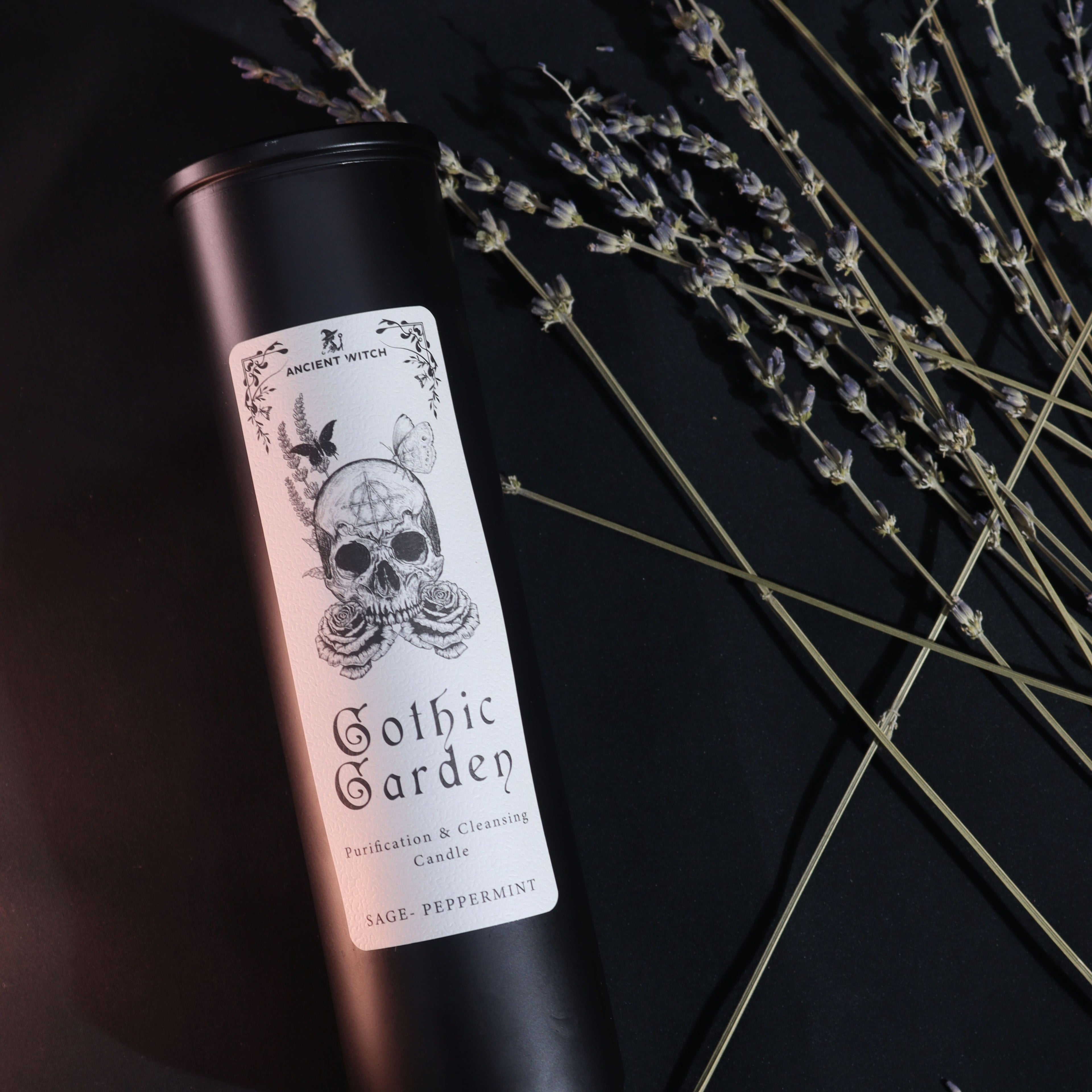 Candle with 'Gothic Garden' label on a black background with lavender.