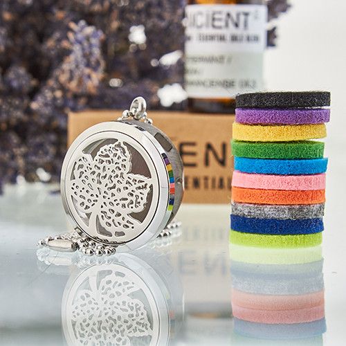 Aromatherapy locket necklace with 10 coloured refill pads for essential oils