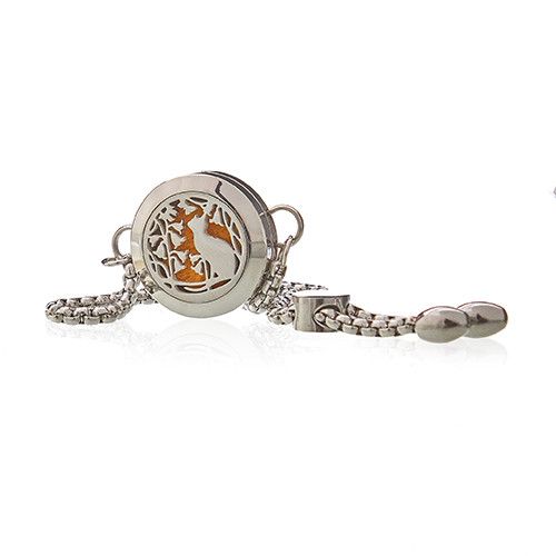 Silver bracelet with a round decorative element on a white background