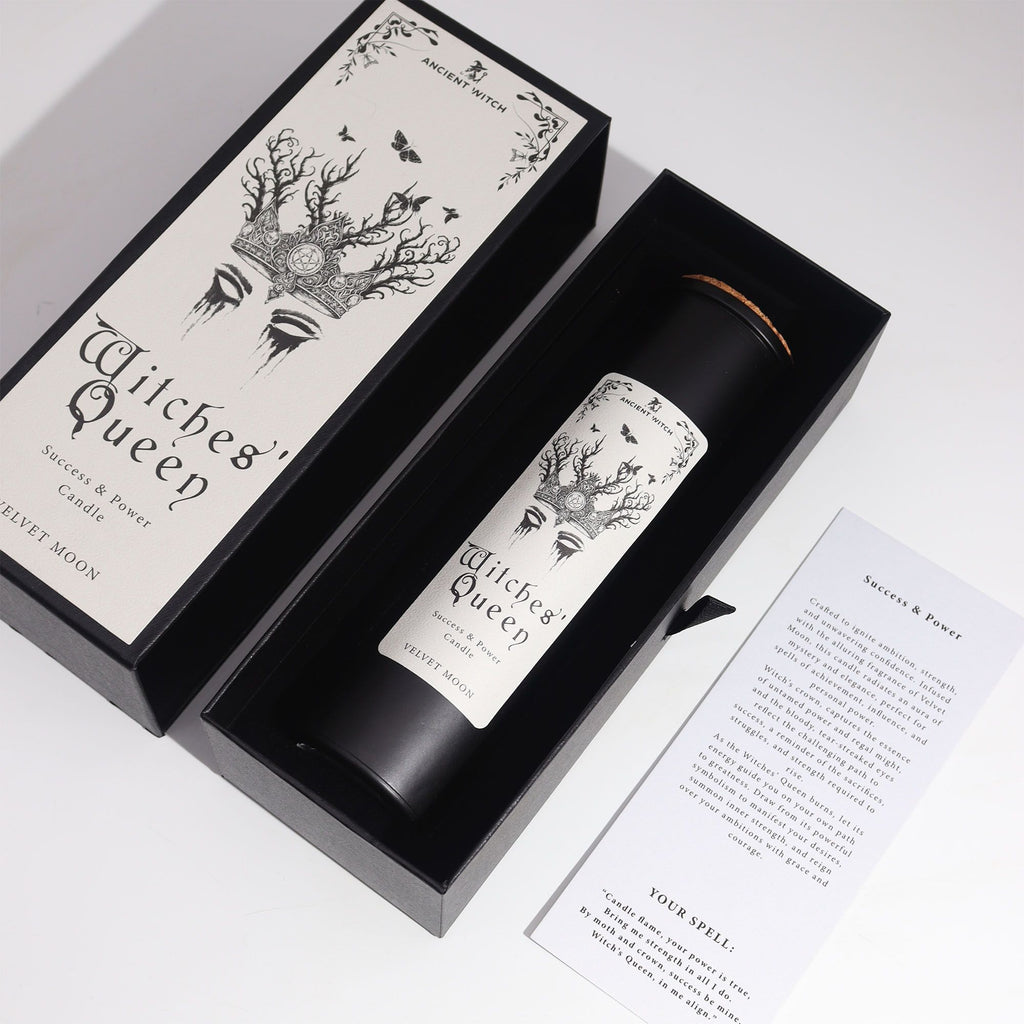 Candle labeled 'Witches' Queen' in a black box with decorative design on a white background