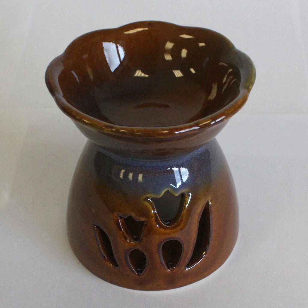 Brown ceramic oil burner with tulip design on a white background