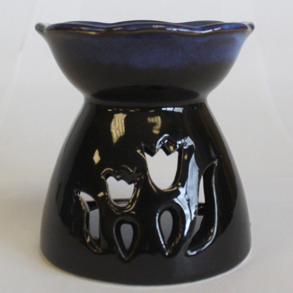 Black/blue ceramic oil burner with tulip design on a white background