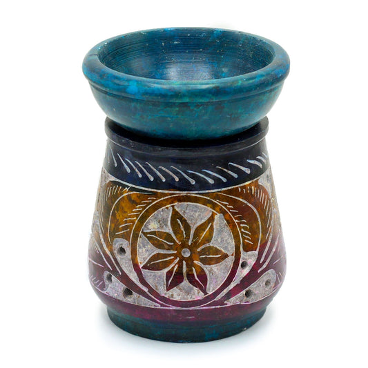 Ceramic oil burner with blue top and decorative base on a white background