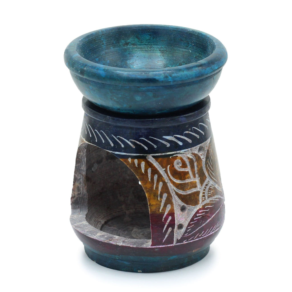 Ceramic oil burner with blue top and patterned base on a white background
