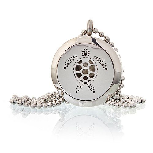 Silver pendant with intricate design on a white background