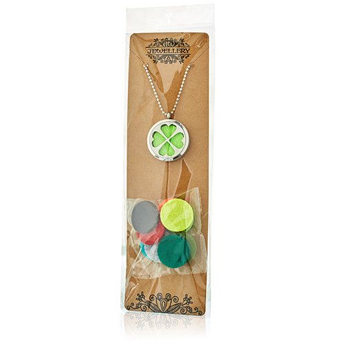 Necklace with a clover pendant in a brown packaging sleeve on a white background